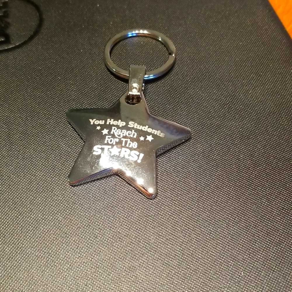 Silver, star keychain. "You help students reach for the stars!" Heavy and shiny!
